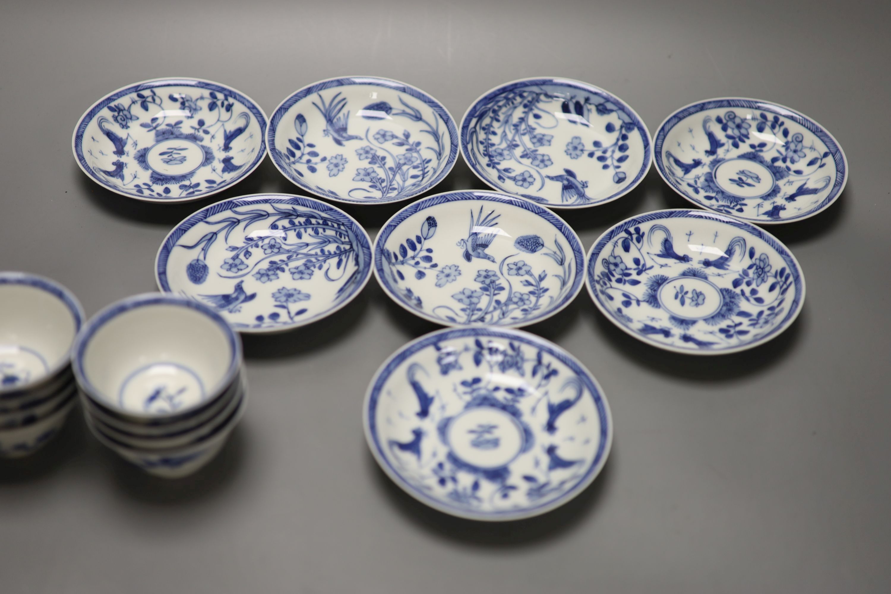 Five Chinese blue and white 'birds' tea bowls and four saucers and three 'chicken' tea bowls and four saucers (16)